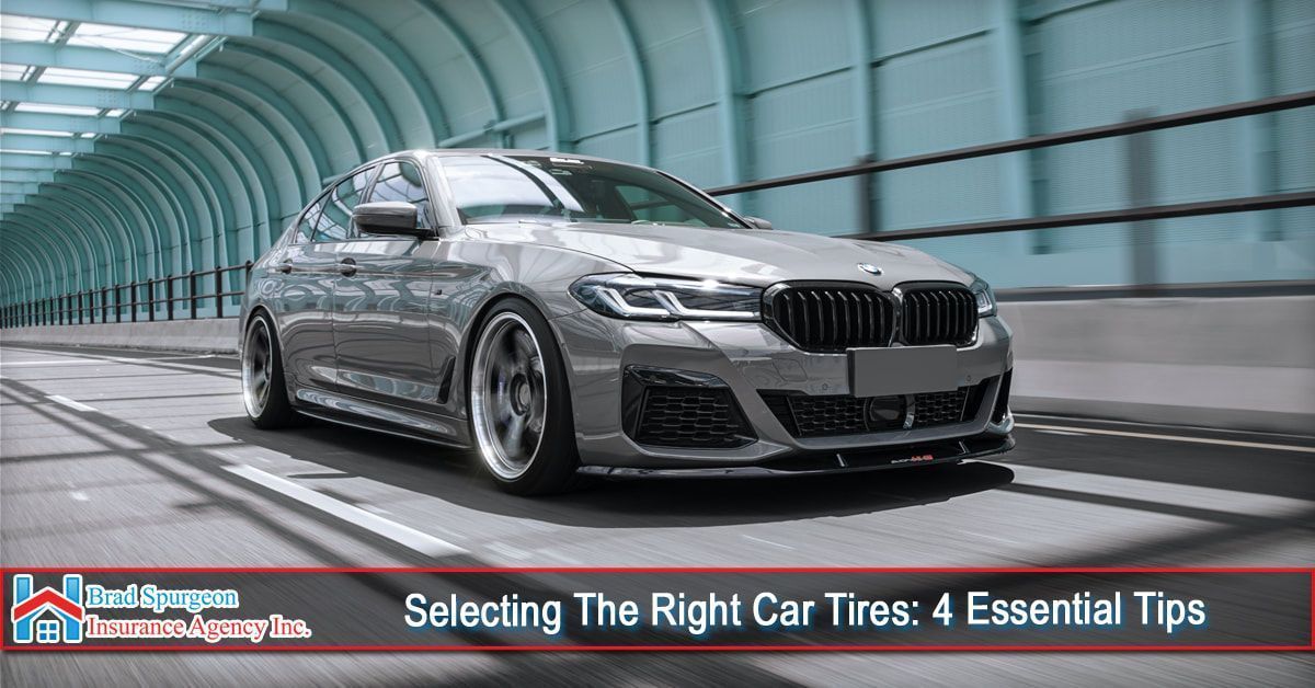 A gray BMW sedan driving through a modern, tunnel-like structure, with text at the bottom about choosing car tires.
