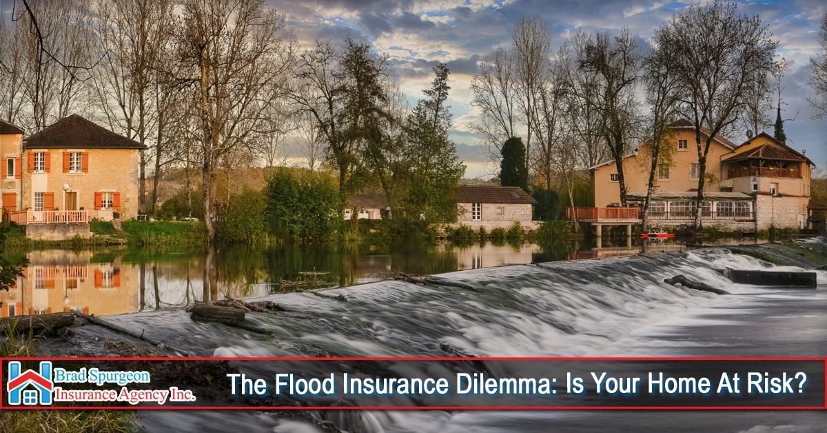 A scenic view of homes near a river with a small weir