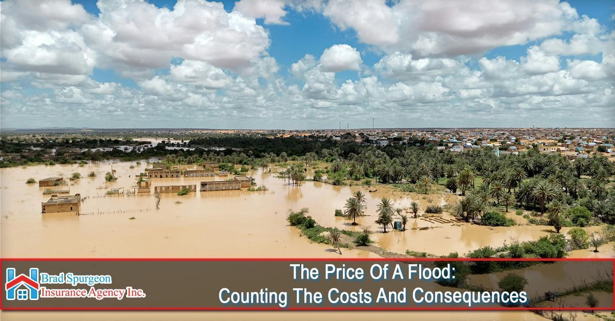 An aerial view of a flooded landscape featuring submerged buildings and trees