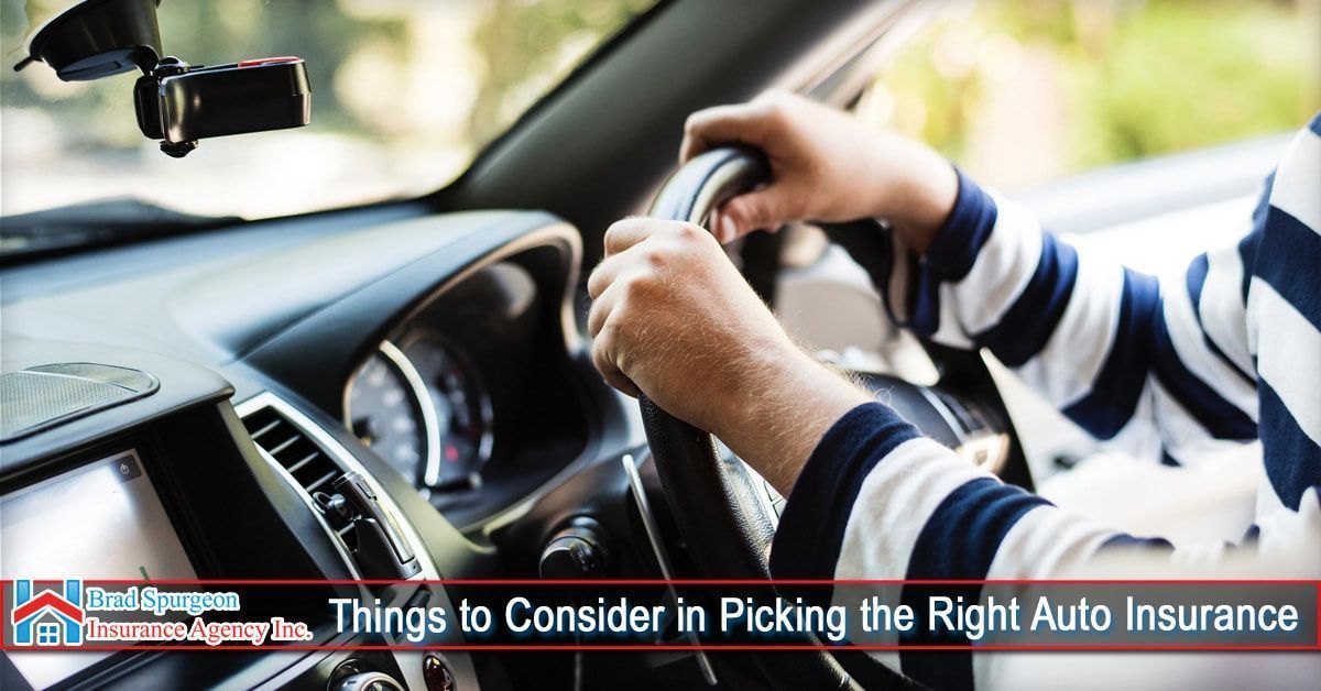 A driver’s hands on the steering wheel