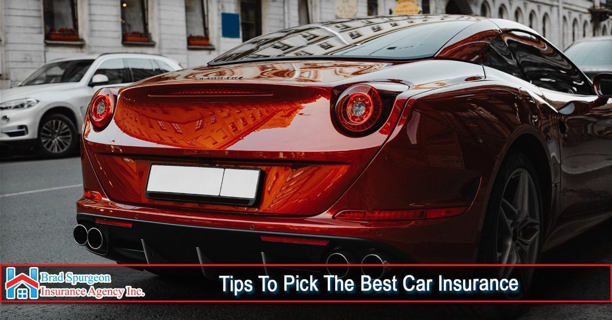 A glossy red Ferrari parked on a city street 