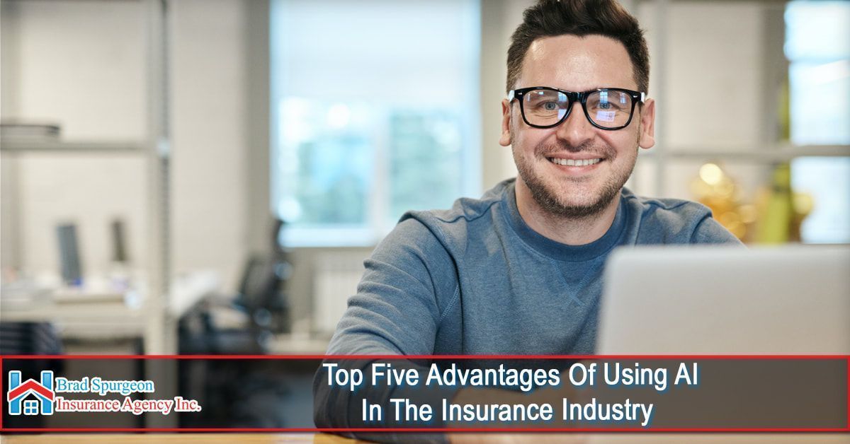 A person smiling at a computer in an office