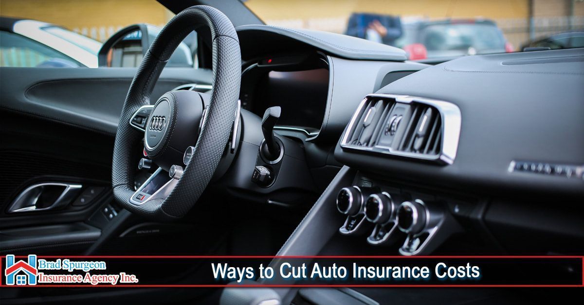 The interior of a modern car with a dark dashboard and steering wheel