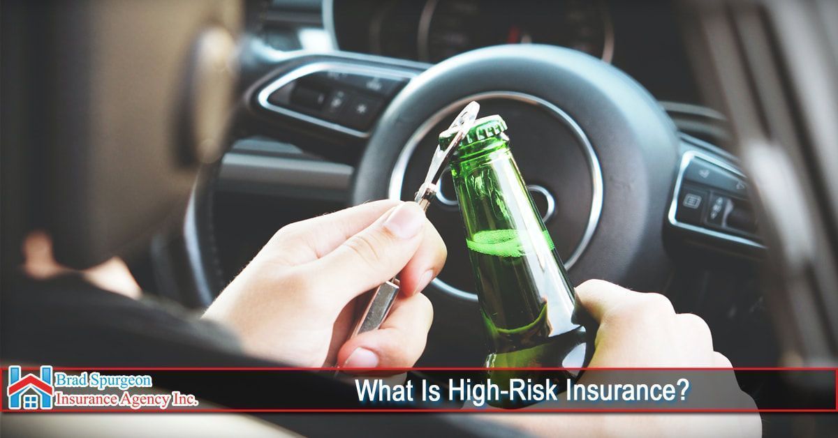 A person in the driver's seat of a car holds a bottle and an opener. 