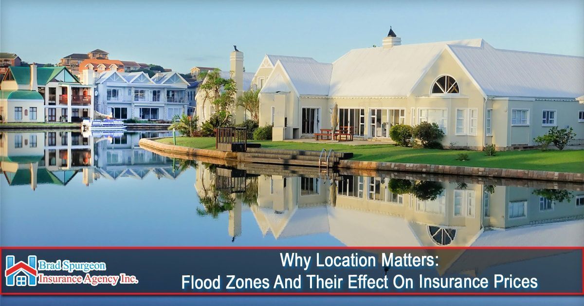 Luxury homes line a calm canal, reflecting in the water