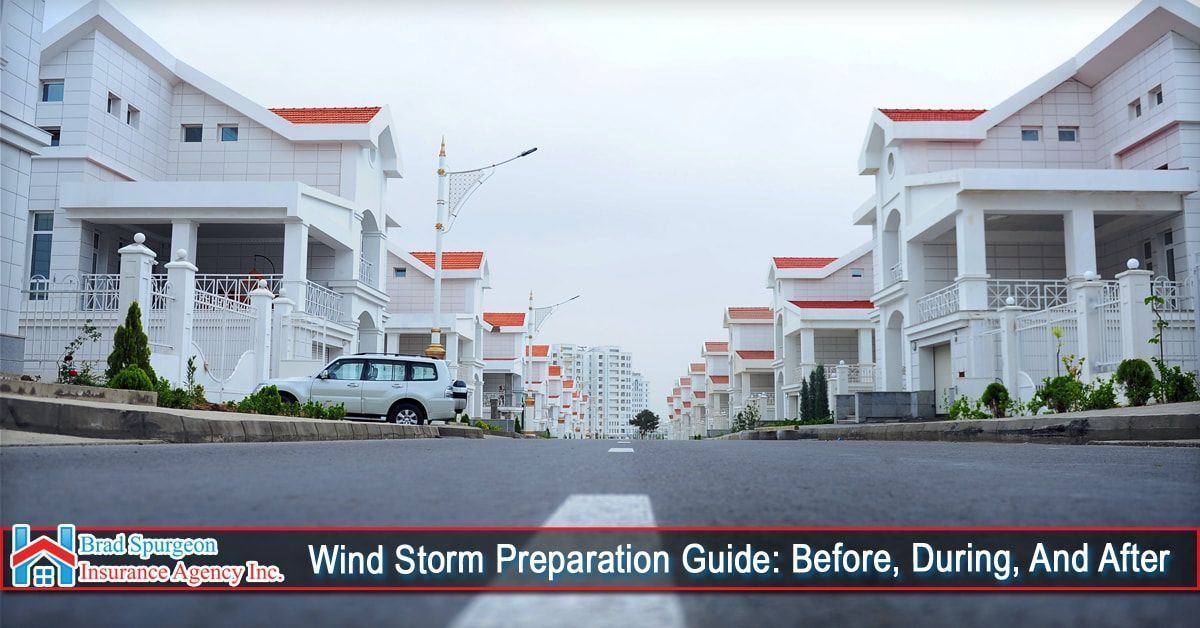 A suburban street with white houses on either side