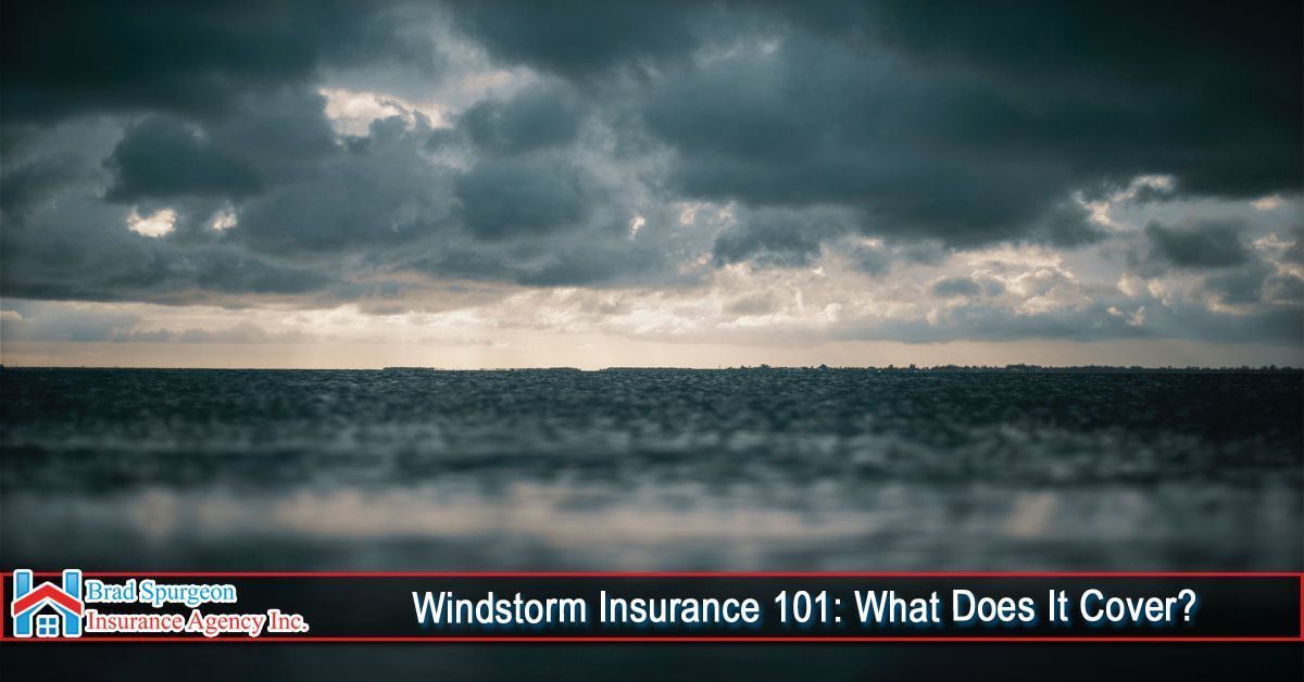 Dark, moody storm clouds over a horizon line above water