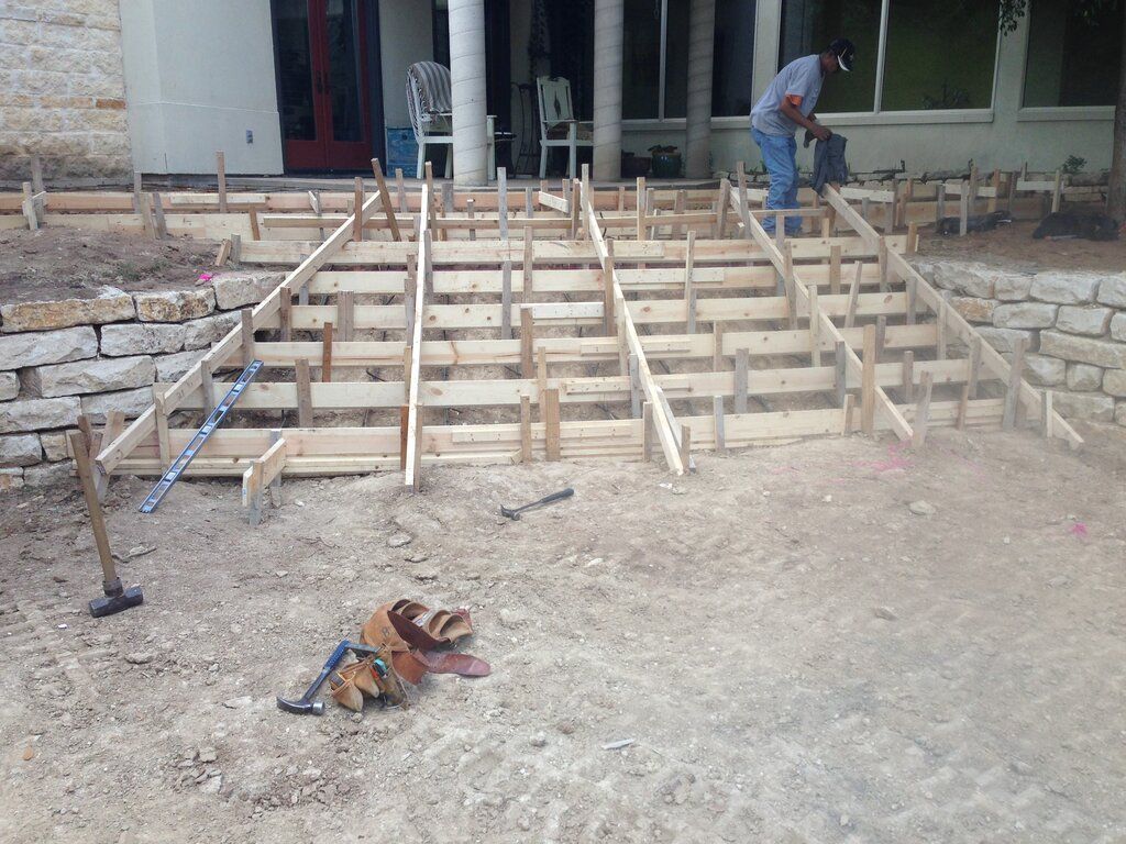 A large concrete building of tilt walls under construction