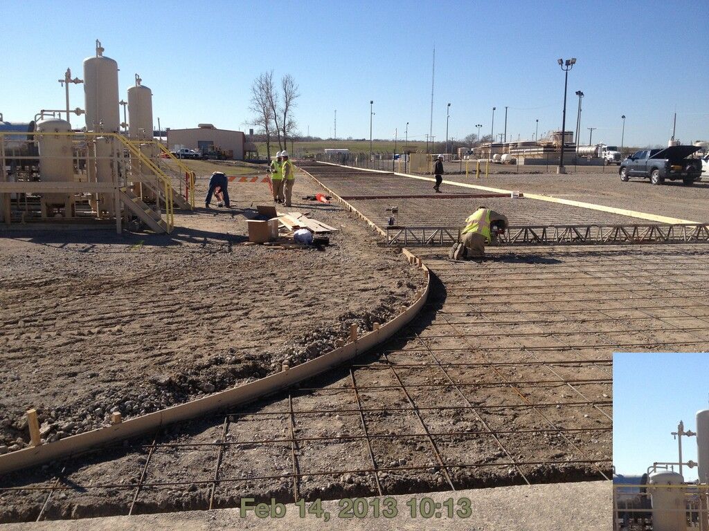 A slab on grade concrete base is being built on a construction site