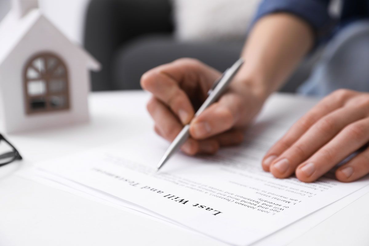 A person signing a document titled 