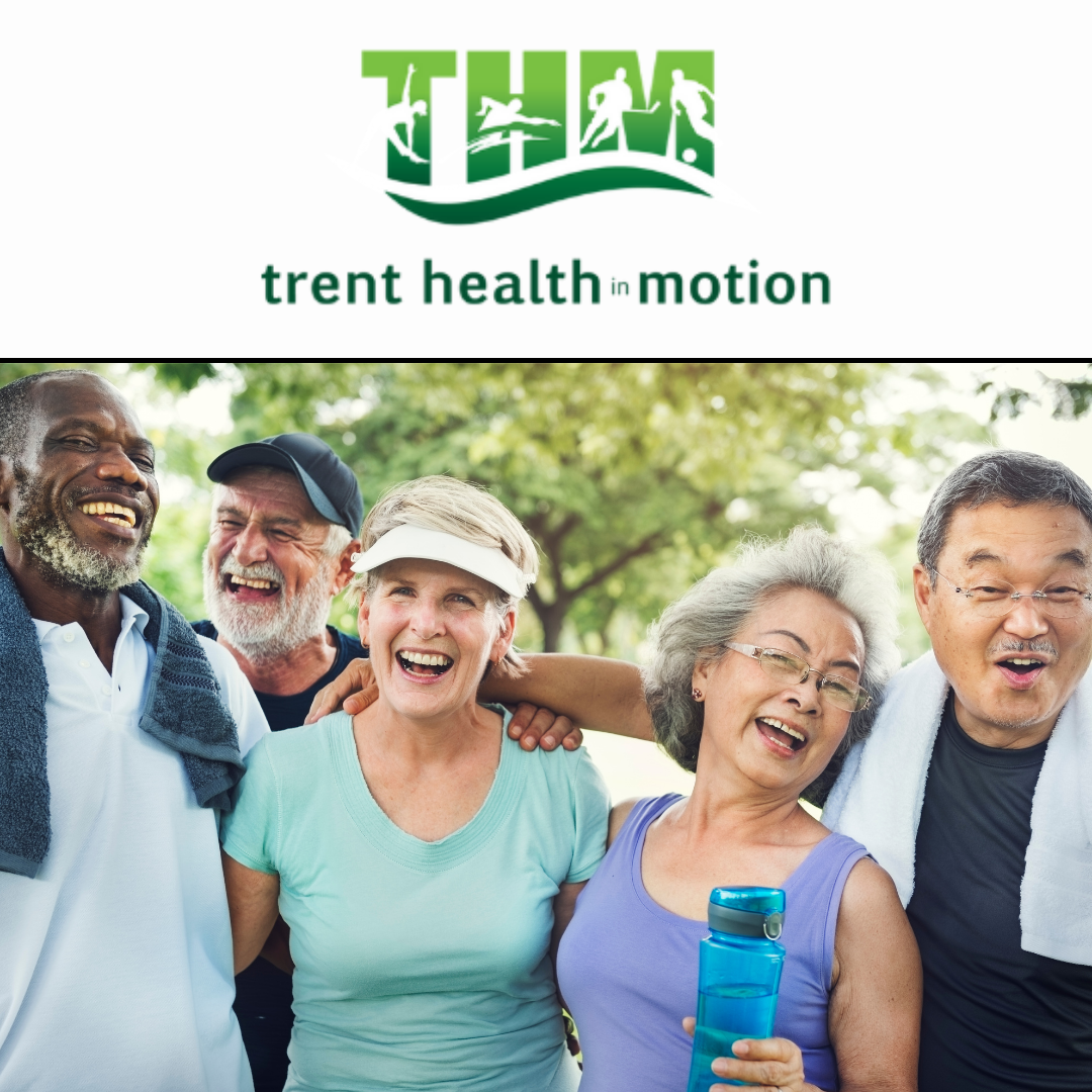 A group of people are posing for a picture with the trent health motion logo in the background