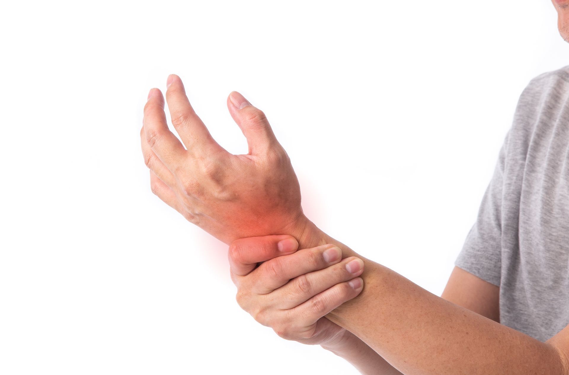 Person holding wrist, showing red area indicating pain.