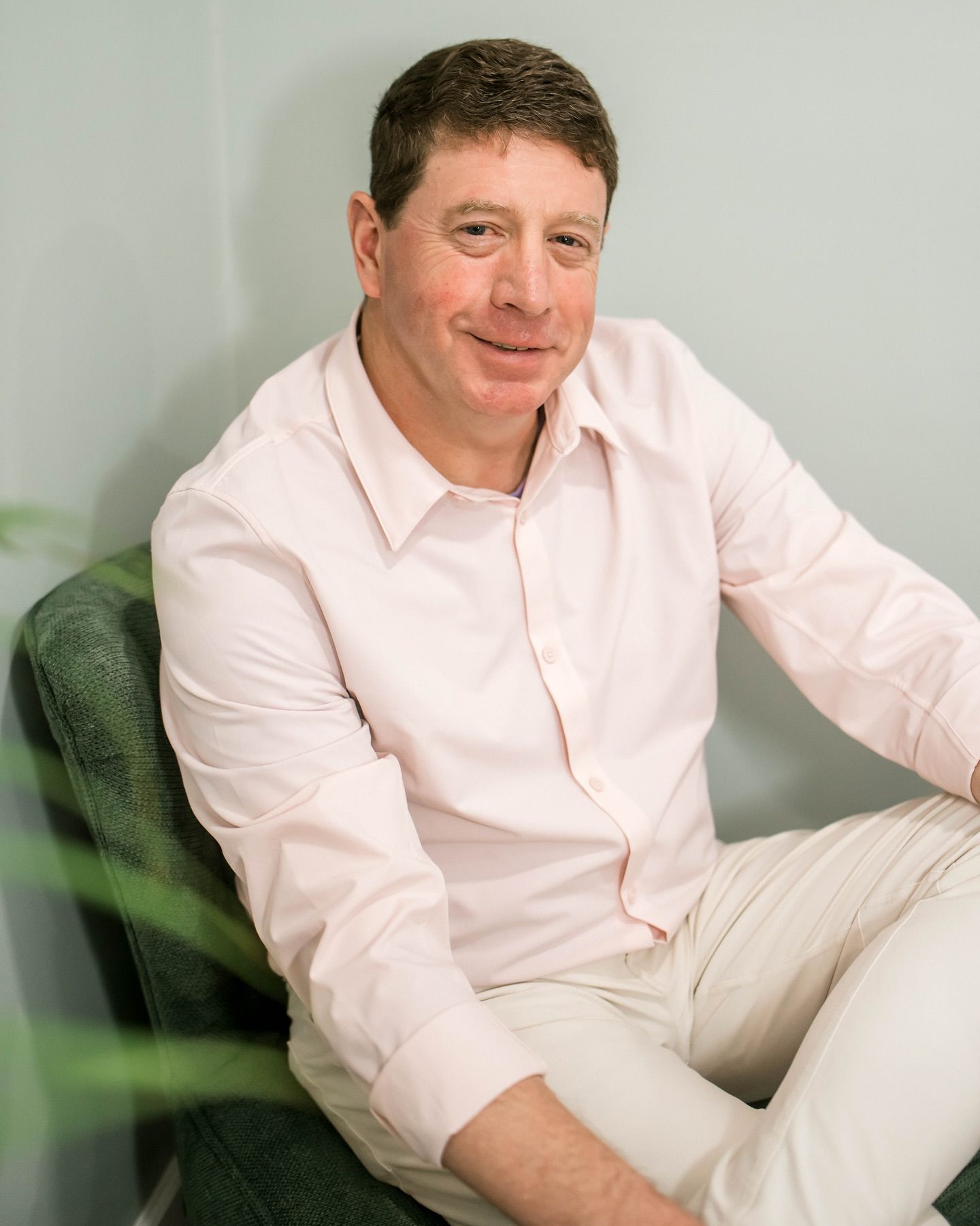 A Man Is Sitting in A Chair — LaGrange, GA — LaGrange Body Lab