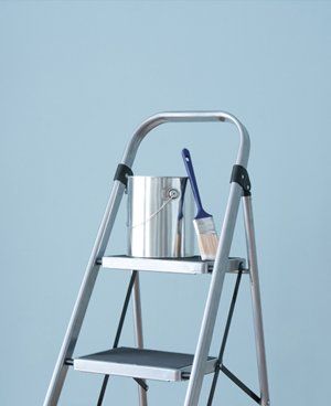 Ladders with paint pot and brush