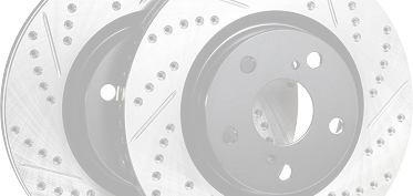 Two car brake rotors with drilled holes and slotted surfaces | Downtown Auto Clinic