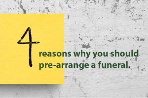 A yellow sticky note with the words `` 4 reasons why you should pre-arrange a funeral '' written on it.