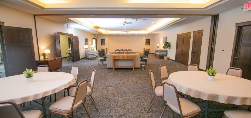 A large room with tables and chairs in it