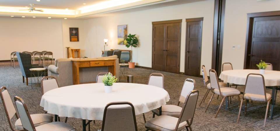 A room with tables and chairs in it