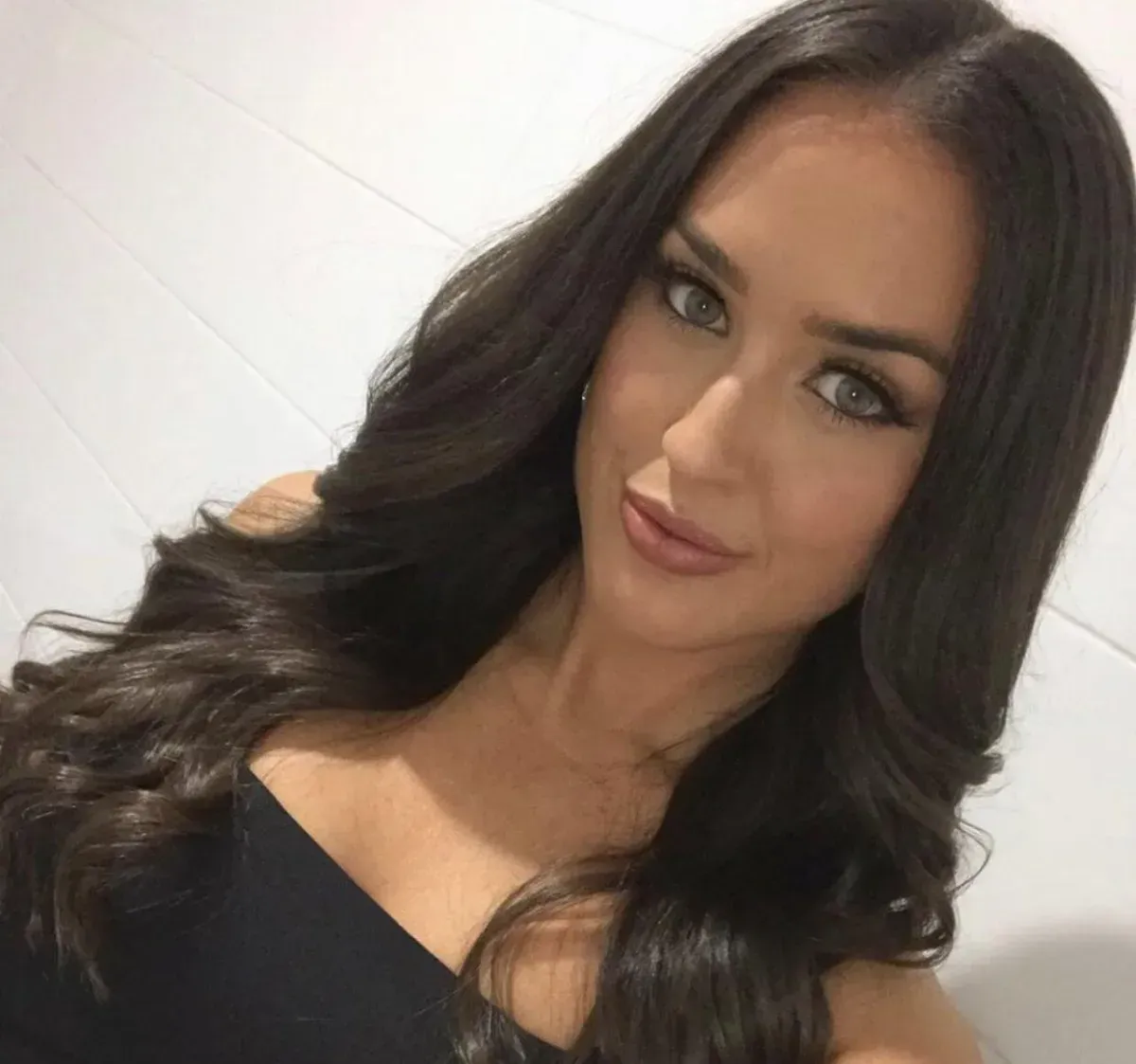 A Woman With Long Dark Hair Is Taking A Selfie — It's All About Brows In Varsity Lakes, QLD