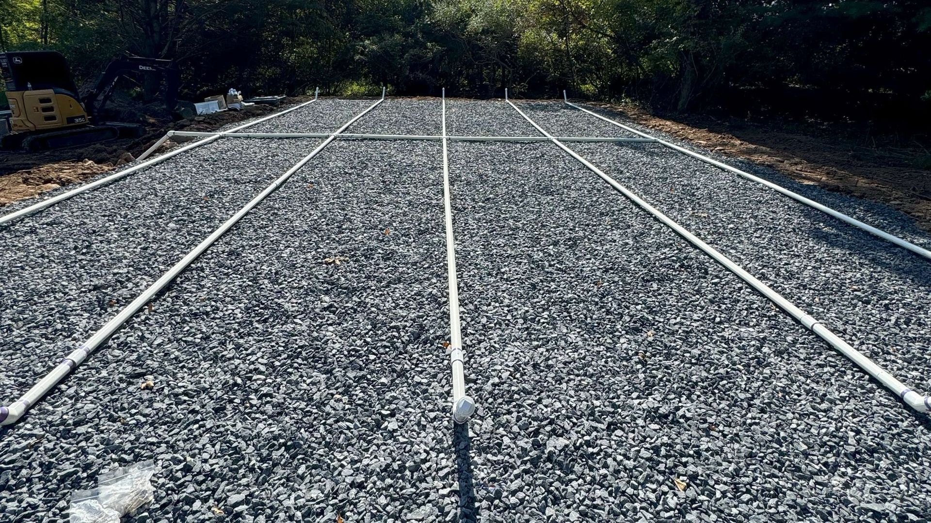 A gravel parking pad by Tailored Excavation.