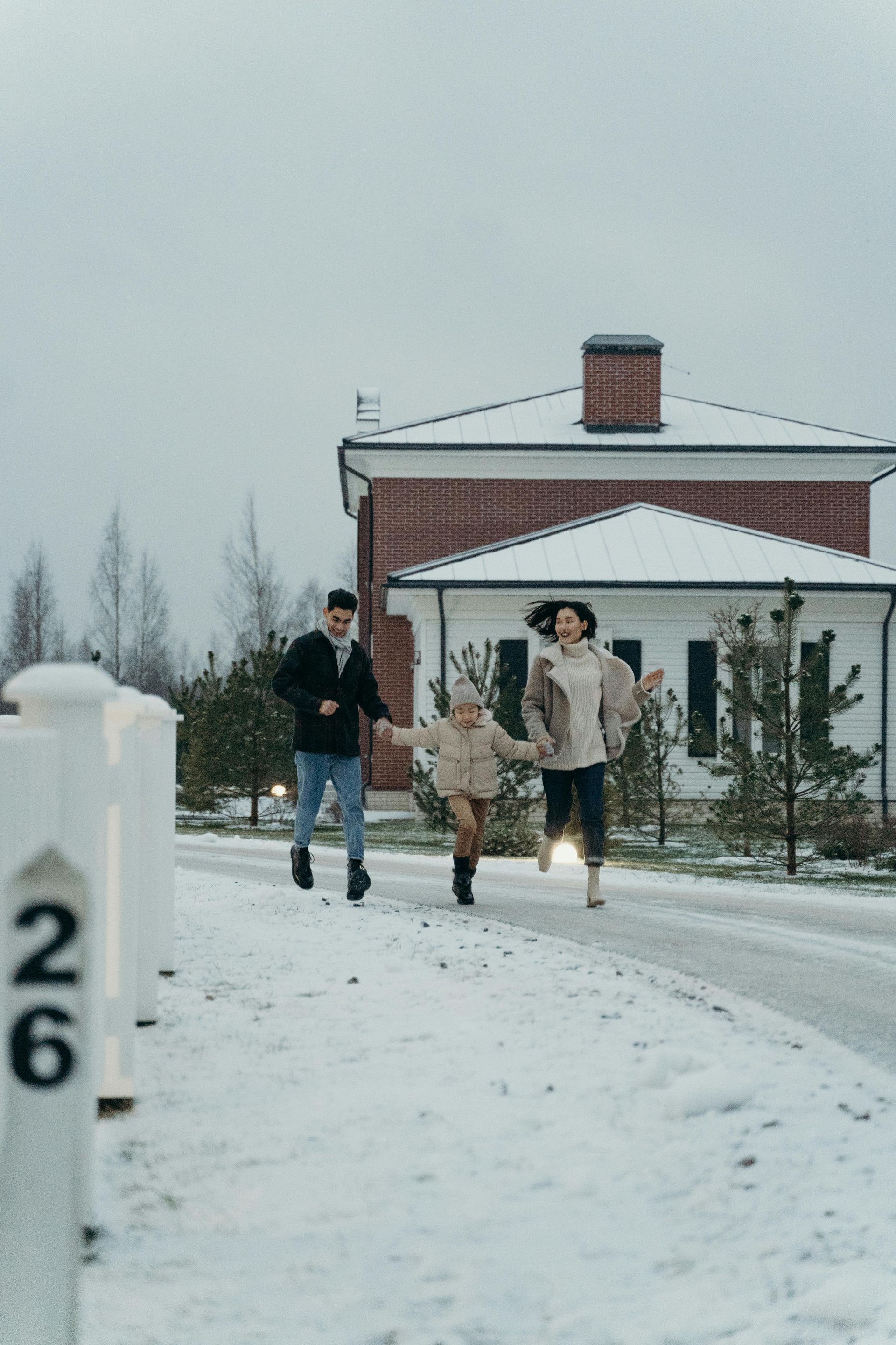 A man in a blue shirt and tie is using a laptop computer.