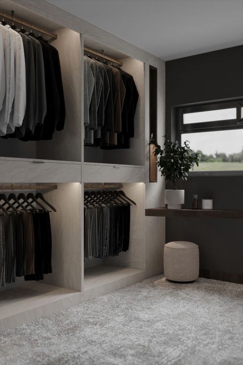 Walk-in closet with dark clothing and shelves. Window with plant, stool, and neutral rug.