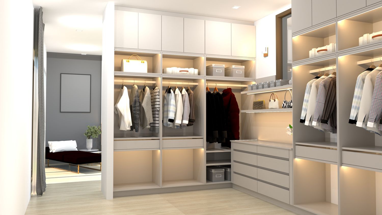 Walk-in closet with shelves, hanging rods, and drawers. Neutral tones; integrated lighting. Leads to a sitting area.