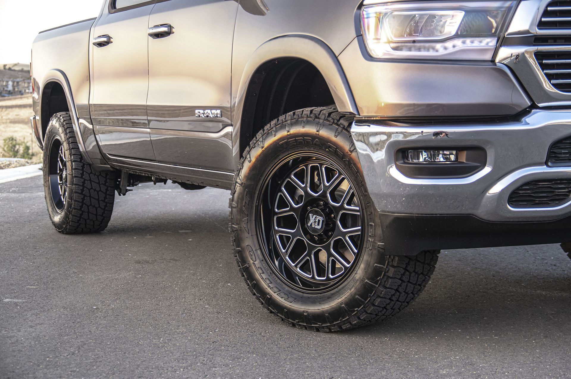 A ram truck is parked on the side of the road