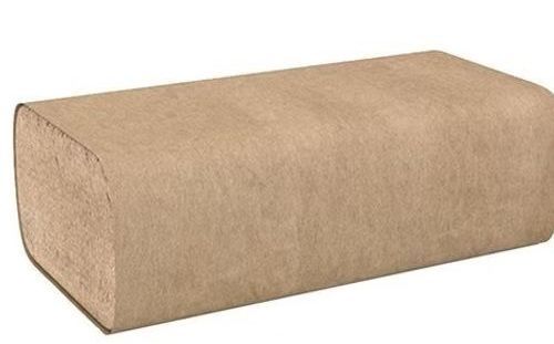 A brown brick is sitting on top of a white surface.