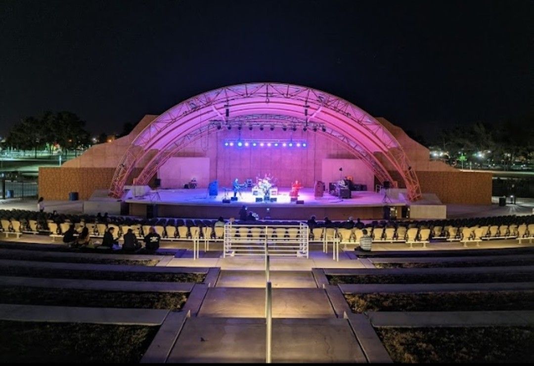 A close up of a dj 's hands playing music on a mixer.
