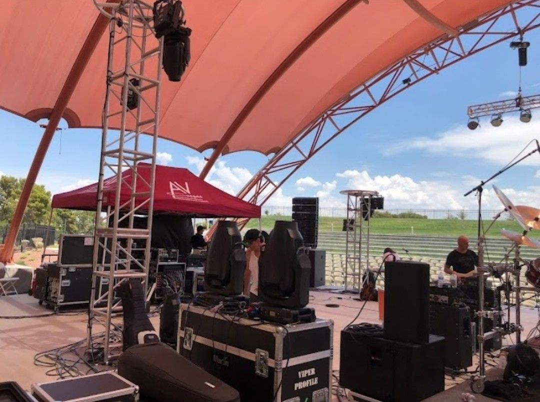 A dj is playing records on a turntable in a club.