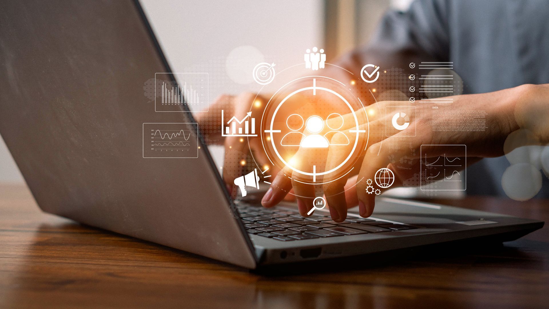 Person typing on laptop, overlaid with digital graphics of data and a targeting reticle.
