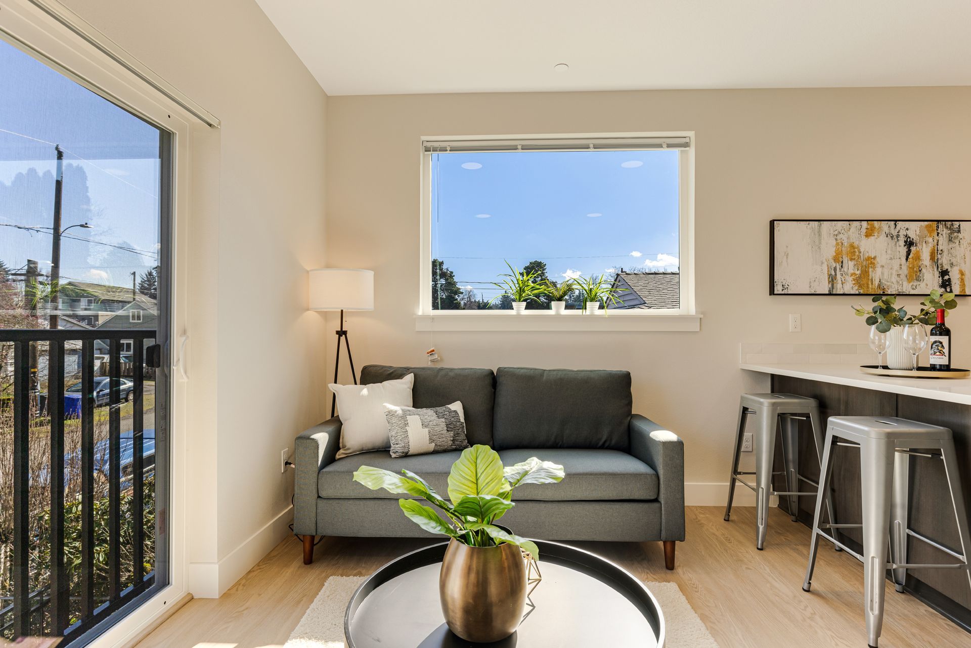 A living room with a couch , table and window