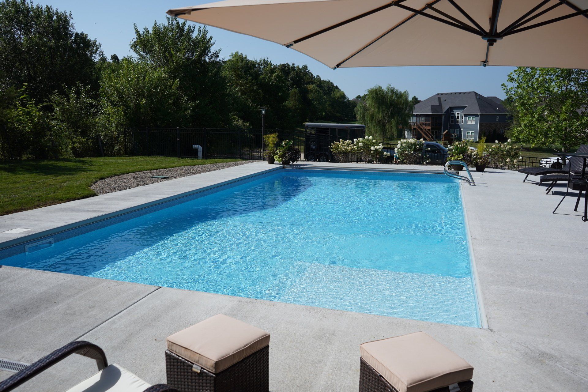 Relax Poolside at Your New Vinyl Liner Inground Pool in Columbia, MO With Peavler Construction.