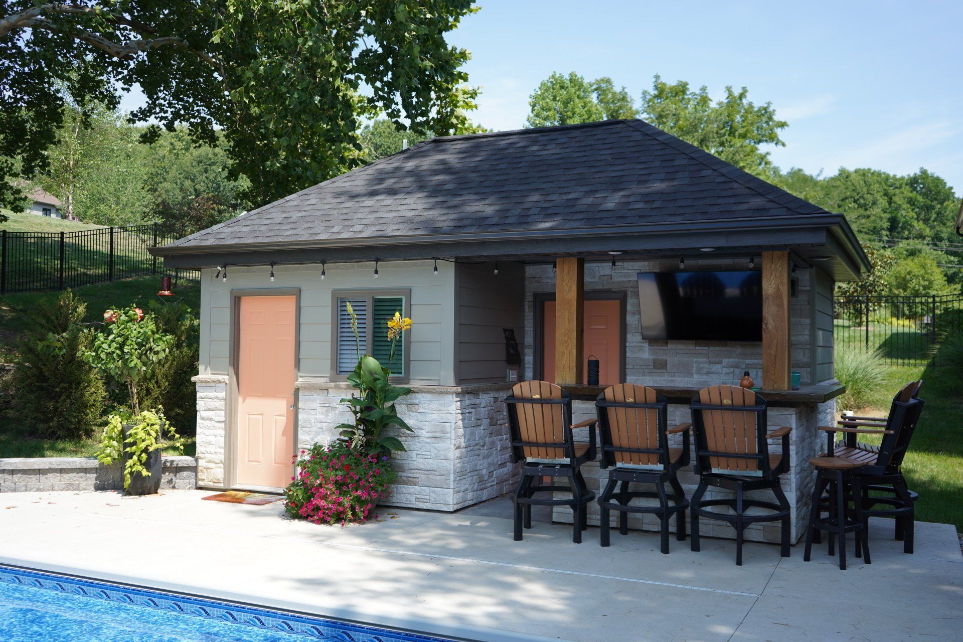 Catch the Game & Enjoy Pool Time at Your Pool House Built by Peavler Construction in Mid-Missouri.