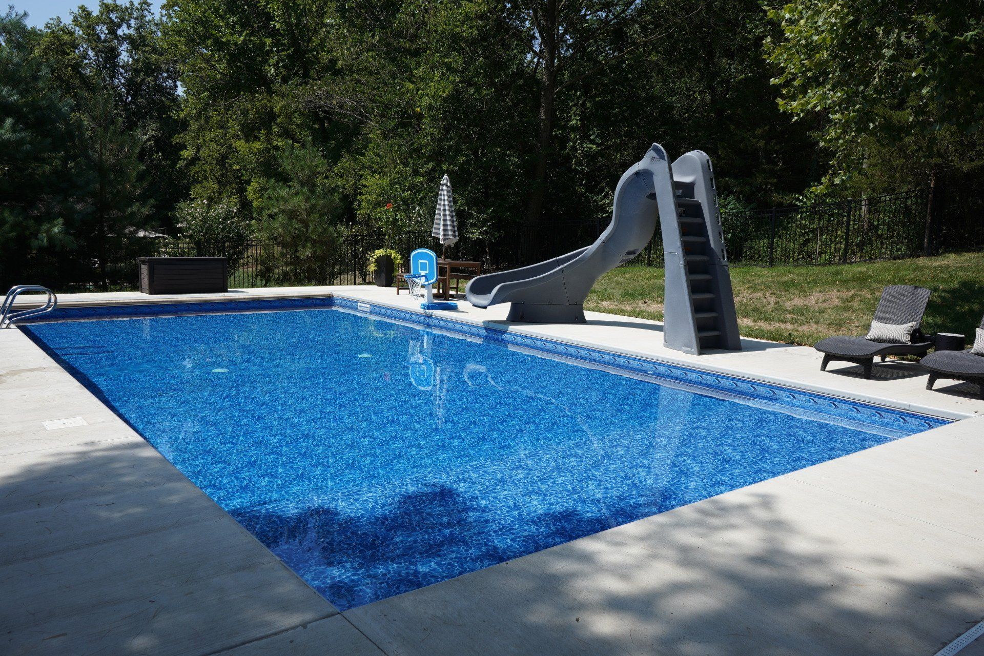 Rectangular Pools Are Great for Lap Swimming & Play. Add a Slide for Extra Fun in Mid-Missouri.