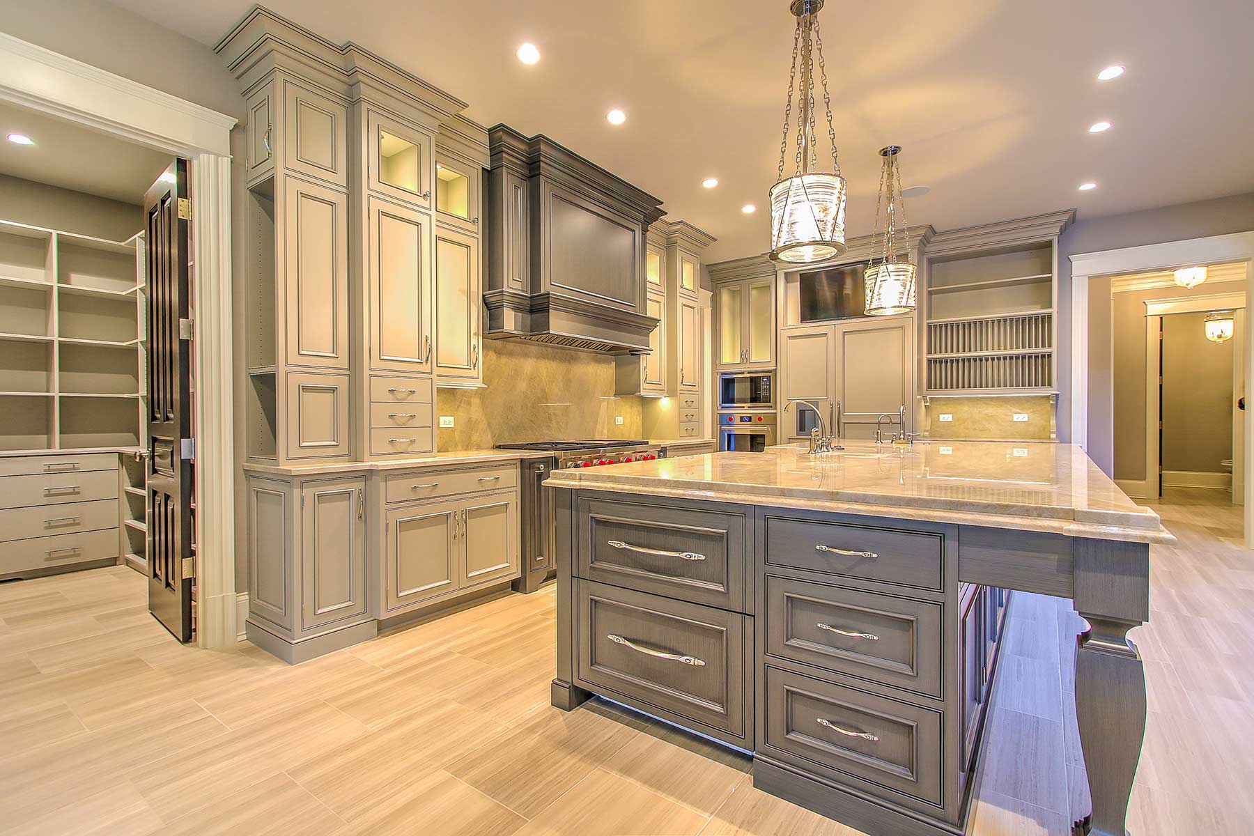 There is a large island in the middle of the kitchen.