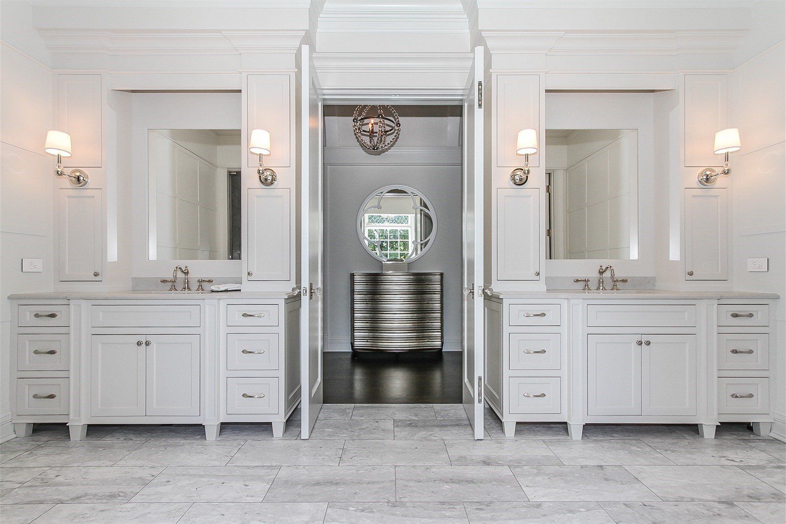 A bathroom with two sinks and two mirrors