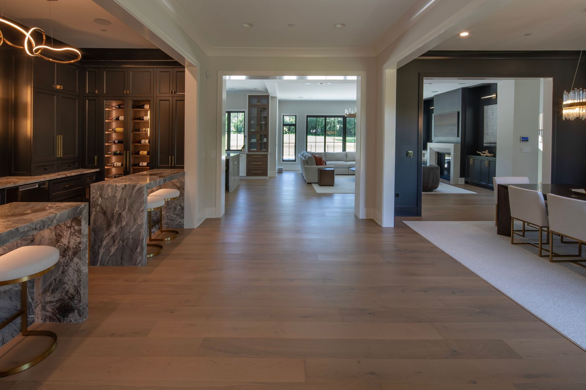 A large house with a kitchen , dining room , and living room.