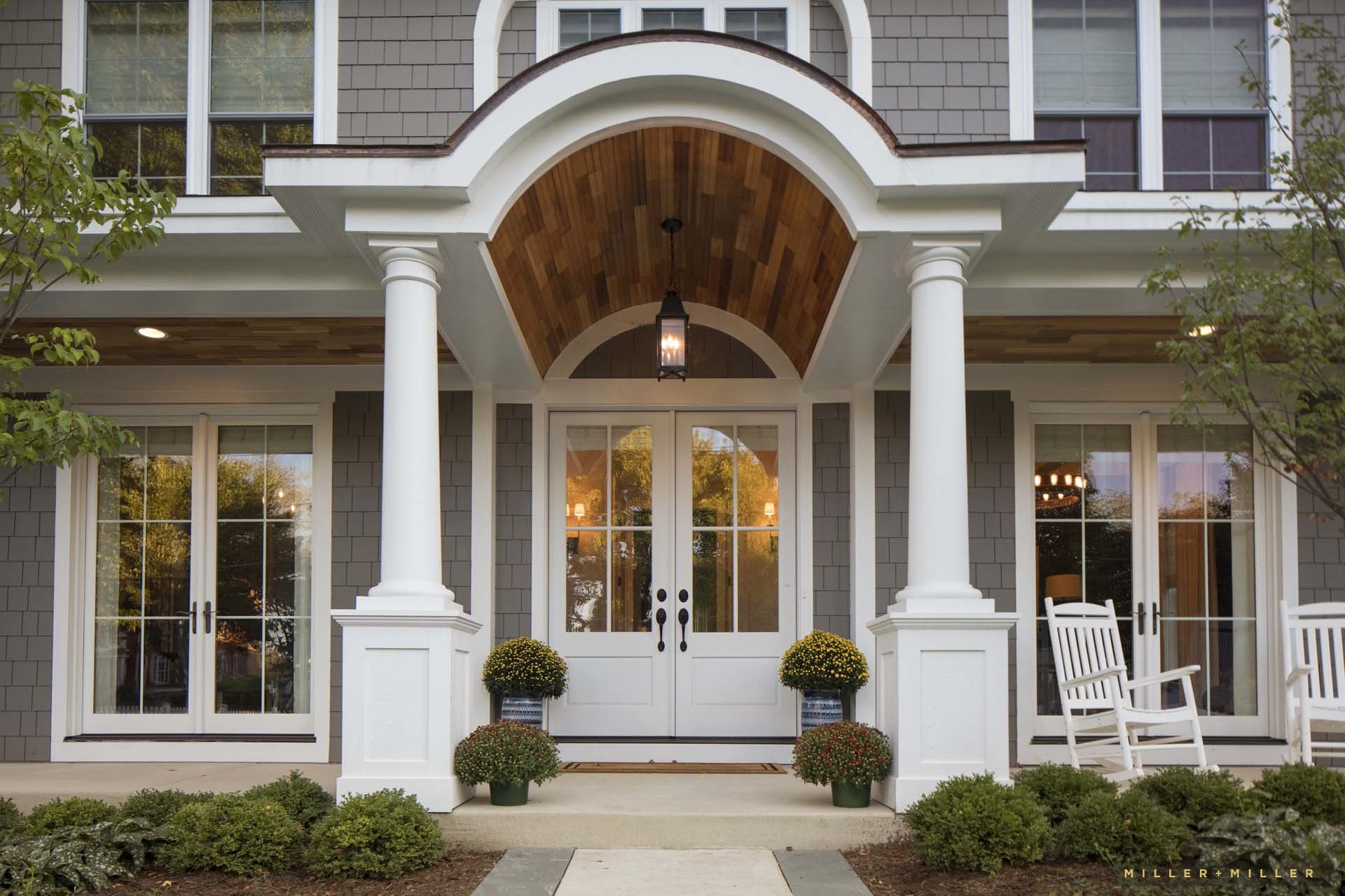 The front of a house with a porch and columns