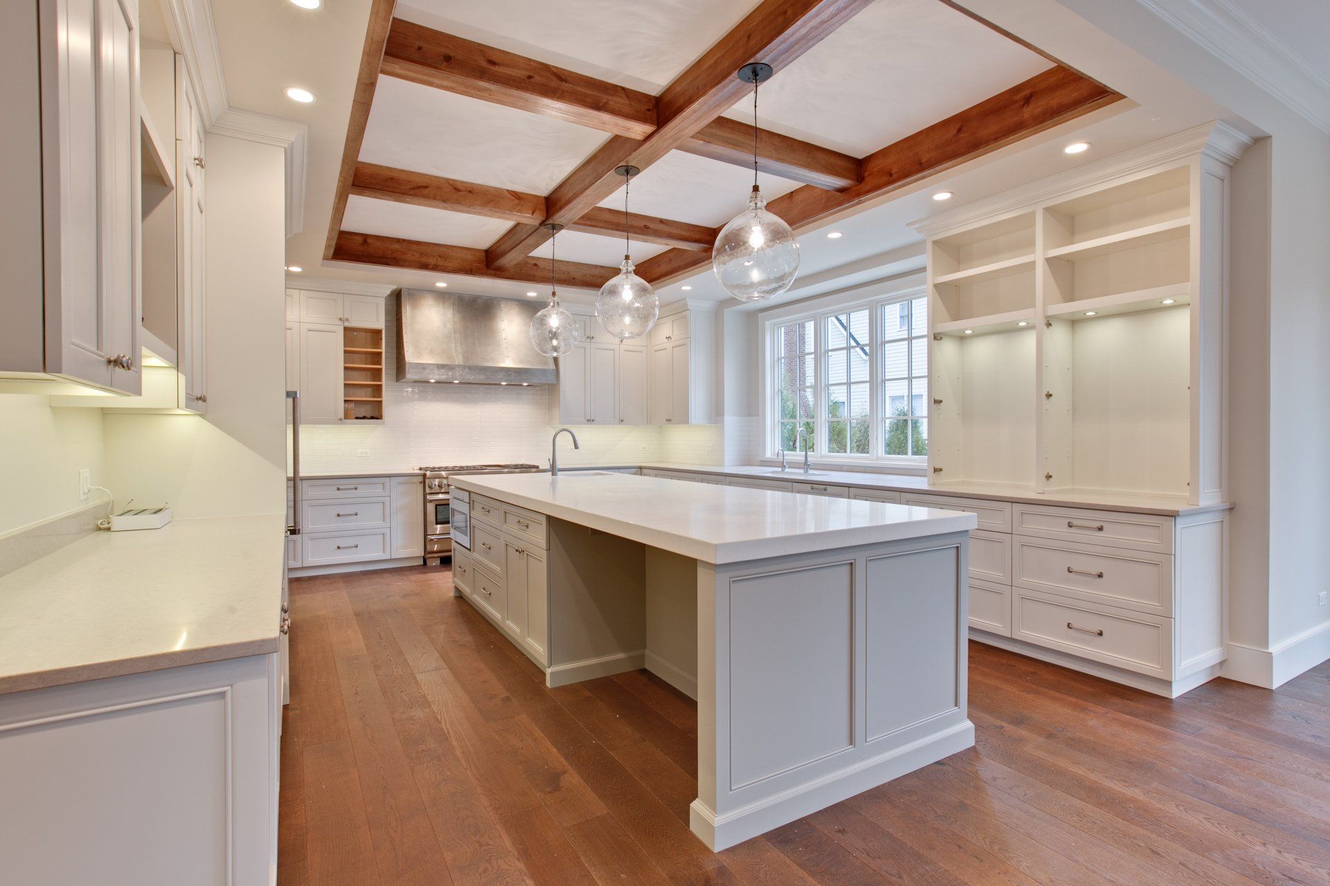 There is a large island in the middle of the kitchen.