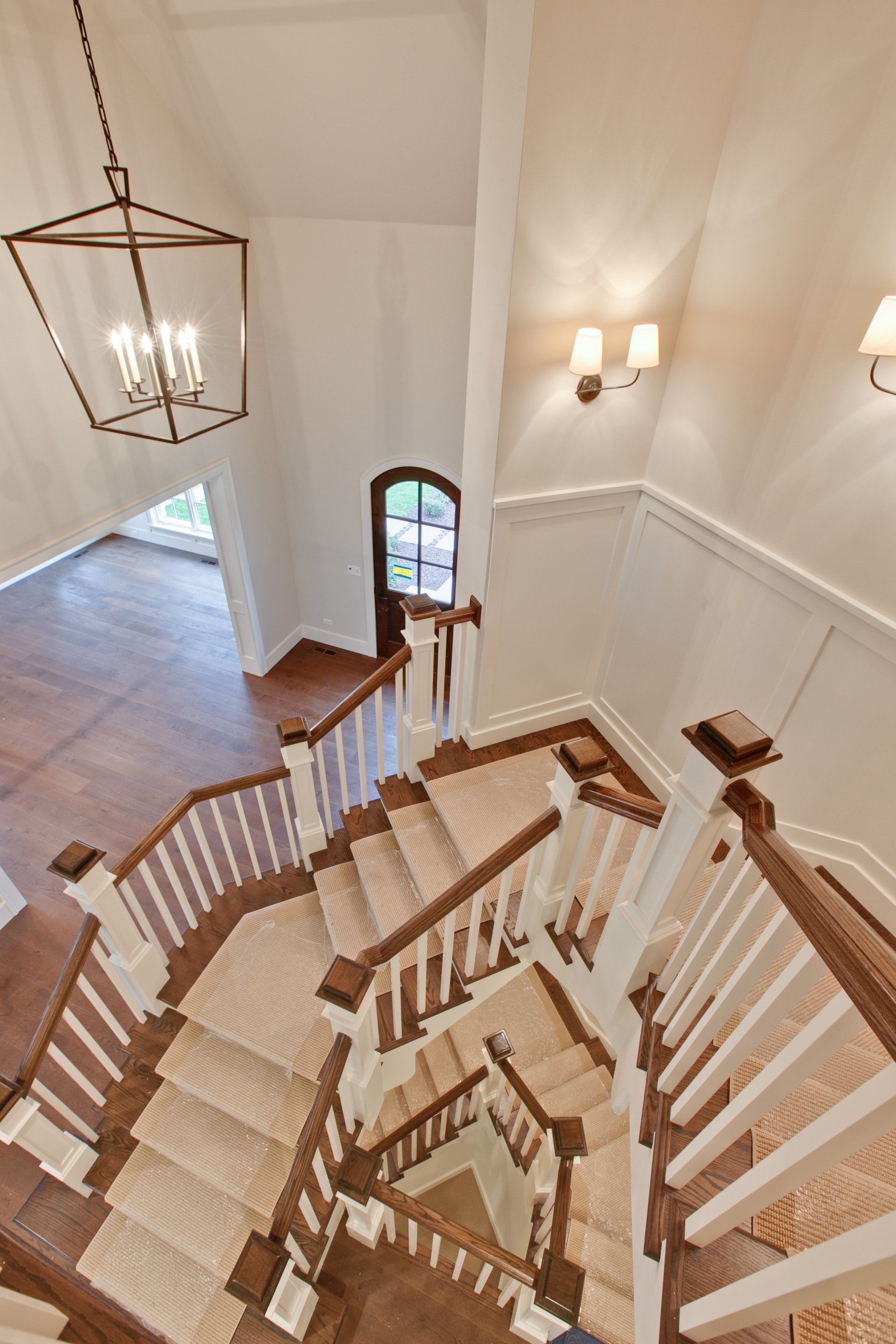 An aerial view of a spiral staircase in a house.
