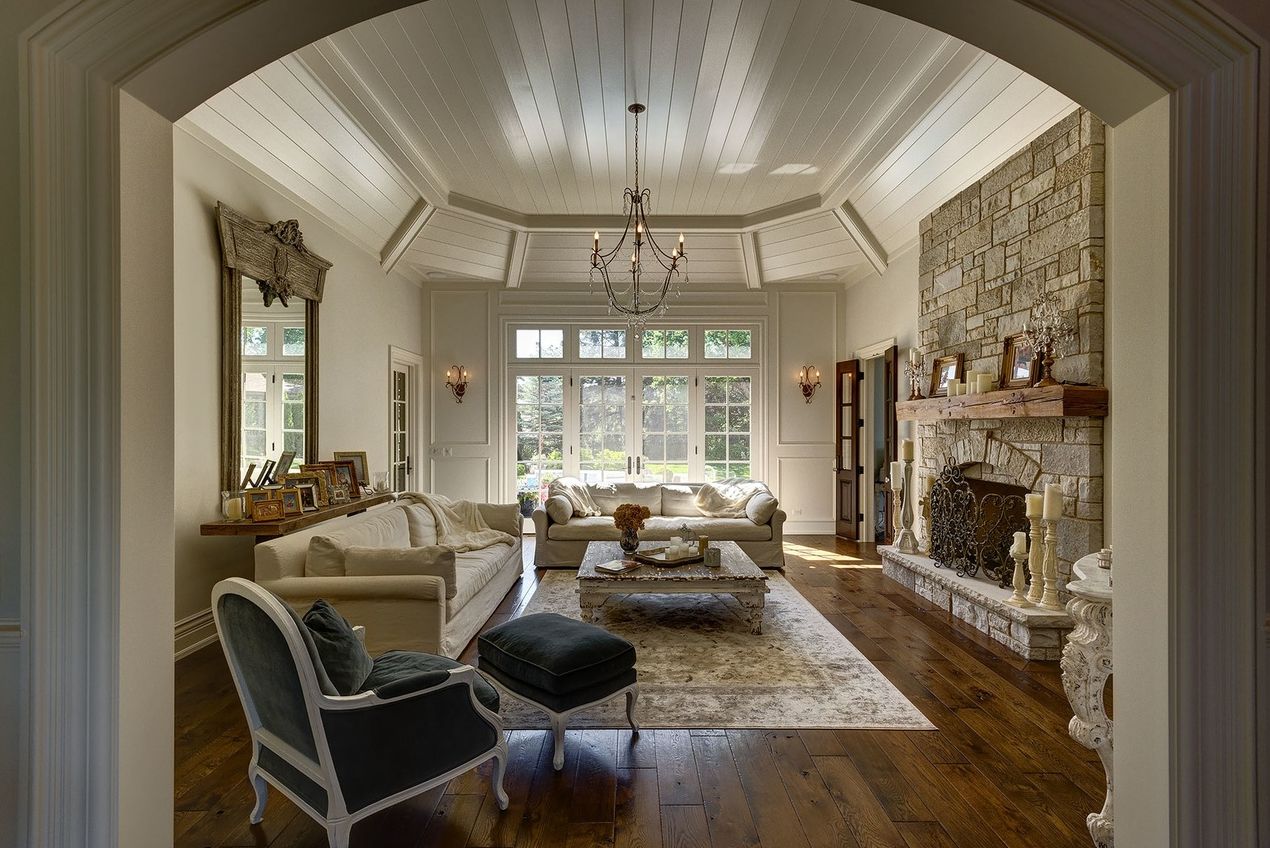 A living room filled with furniture and a fireplace.