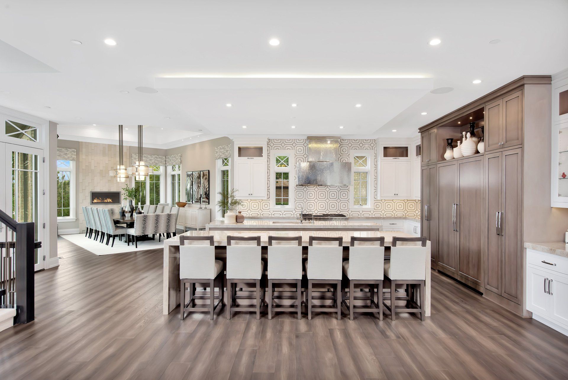 A large kitchen with a large island and stools.