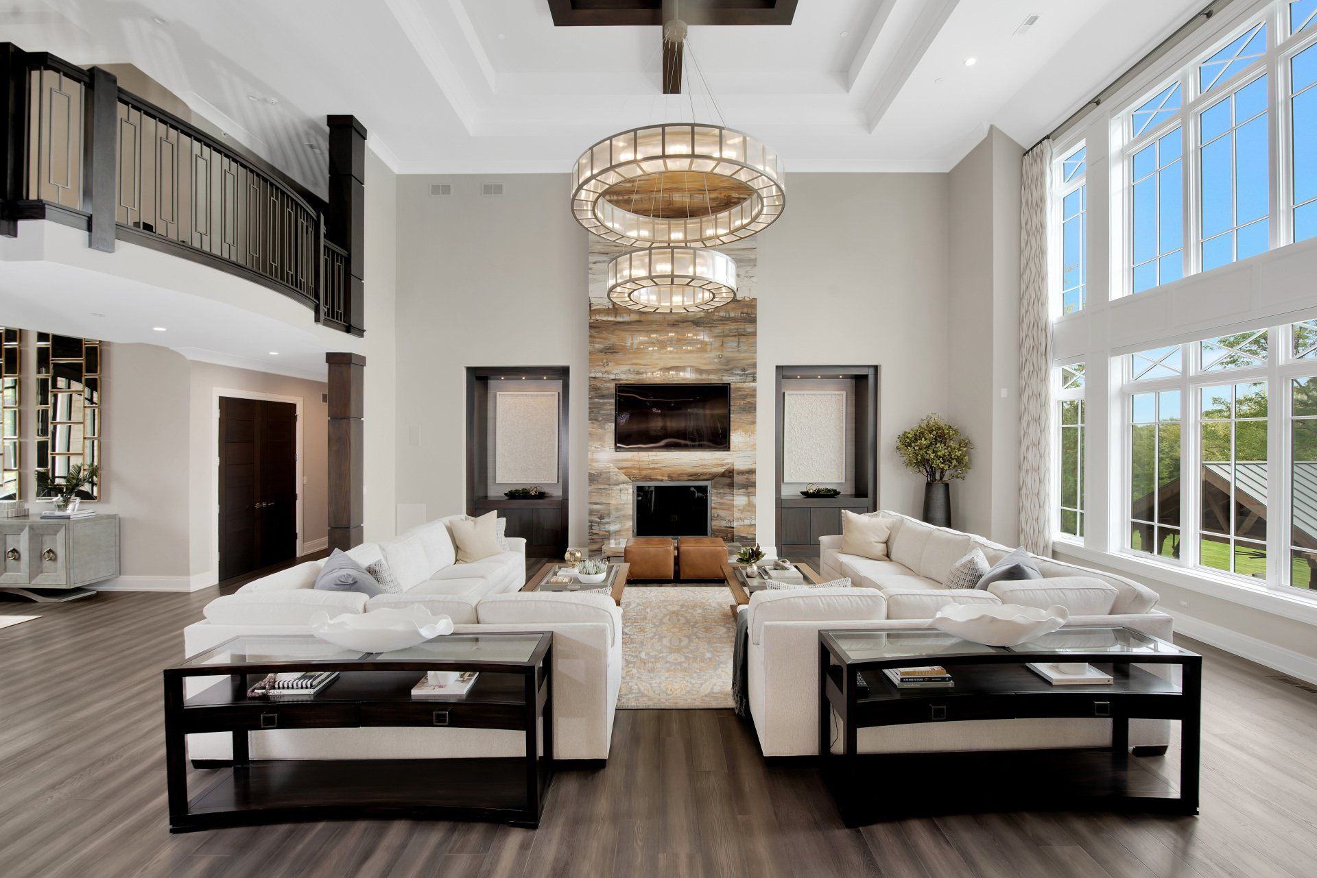 A living room with a lot of furniture and a fireplace.