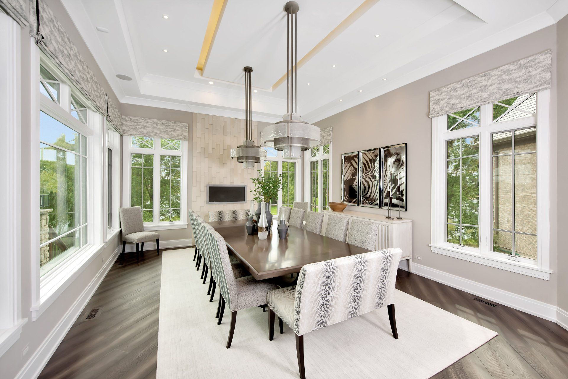 A large dining room with a long table and chairs