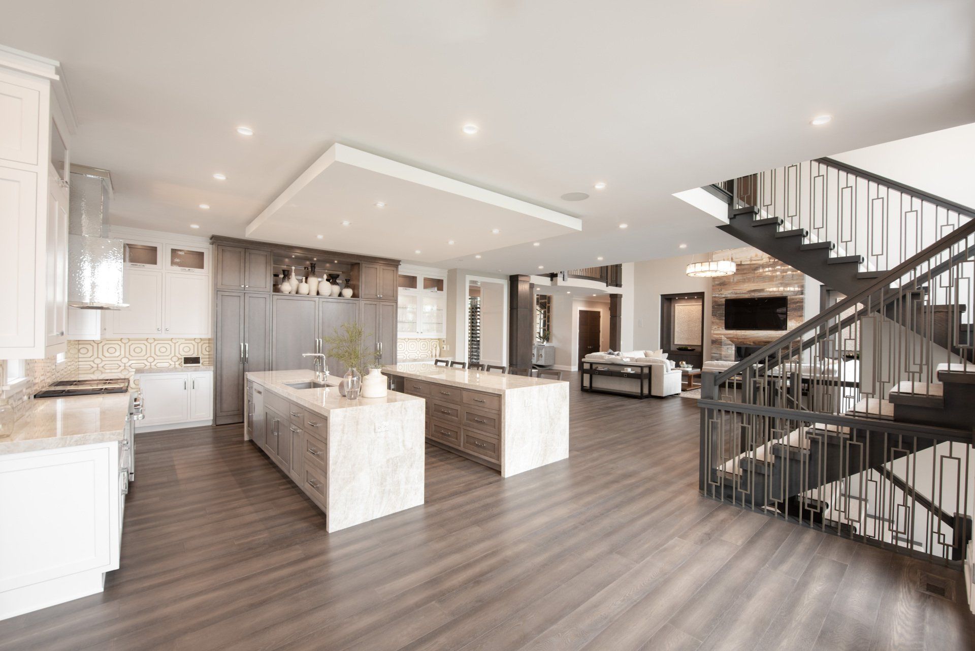 A large kitchen with a staircase leading to the second floor.