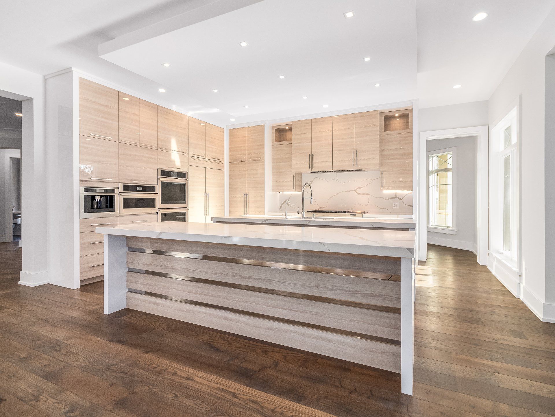 There is a large island in the middle of the kitchen.