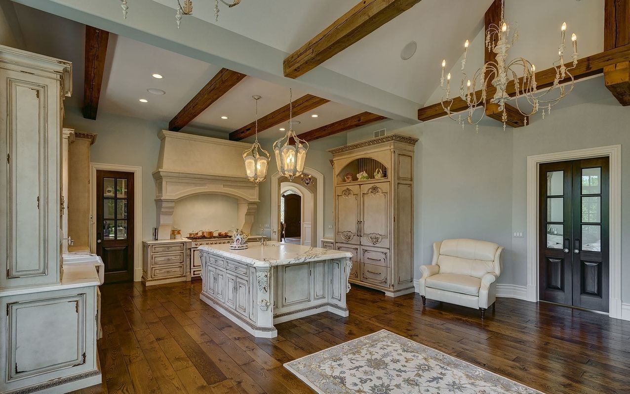 There is a large island in the middle of the kitchen.