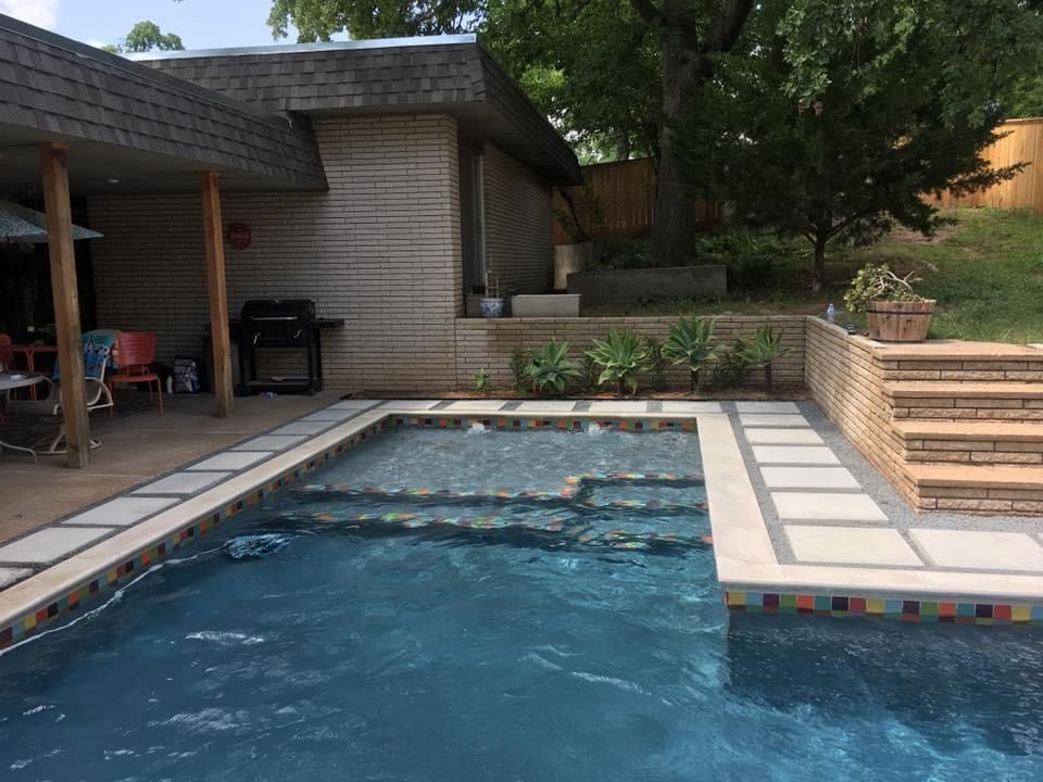 A large swimming pool in the backyard of a house